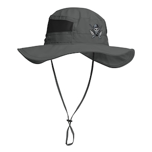May include: A gray sun hat with a wide brim and a black mesh panel. The hat features a black and white skull and crossbones design with wings. It has an adjustable chin strap.