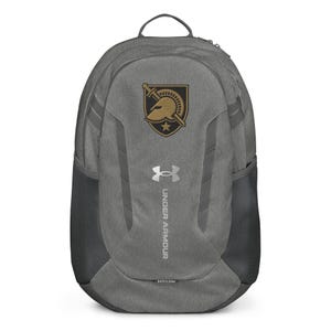 May include: Gray Under Armour backpack with a black mesh side pocket. The backpack features a gold and black emblem and the Under Armour logo in silver. The backpack has a top handle and adjustable straps.