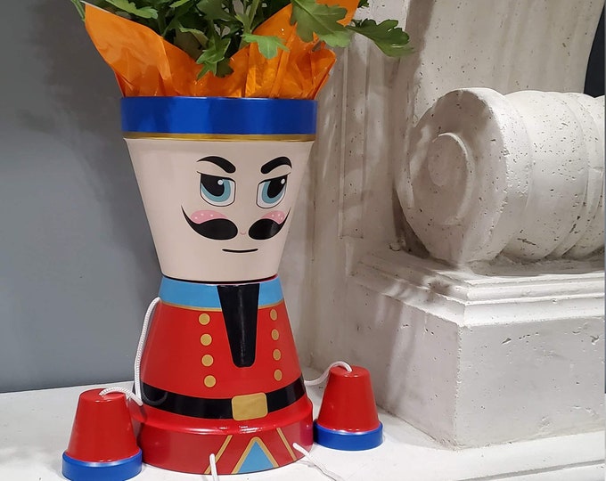 Christmas Nutcracker ,flower pot people home decoration .high quality coated metal no rust and harsh weather approved