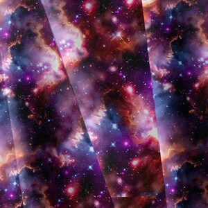 May include: A fabric featuring a vibrant galaxy print with deep purple, magenta, and dark blue nebulas. The pattern displays scattered white and blue stars of varying sizes across a dark cosmic background, creating a dense, layered celestial effect.