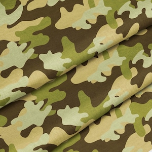 May include: A fabric featuring a camouflage pattern with organic, irregular shapes in shades of dark brown, olive green, light green, and pale beige. The material is folded, creating visible layers and depth across the textured surface.