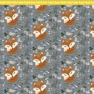 May include: A gray fabric featuring a repeating pattern of sleeping brown foxes, white and blue flowers, and green leaves. A yellow measuring tape is visible along the top and left edges, showing measurements in inches up to 19 inches.