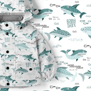 May include: White baby jacket with a blue and green pattern of baby sharks, fish, and the words "Baby Shark" and "Doo Doo Doo Doo Doo".
