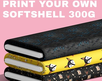 May include: Three stacked rolls of softshell fabric. The top roll is black with a blue honeycomb pattern. The middle roll is yellow with a repeating fox face print. The bottom roll is black with a pattern of wizard hats, letters, and glasses.