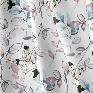 May include: A white fabric featuring a repeating watercolor pattern of delicate leaves and thin branches. The foliage is rendered in soft shades of muted blue, dusty pink, and dark charcoal gray, creating a layered botanical design.