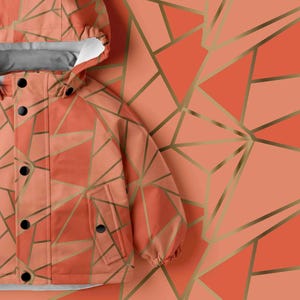May include: A hooded jacket in a coral orange hue featuring a geometric pattern of intersecting gold lines. The garment includes a front placket with five black circular buttons, long sleeves with elastic cuffs, and a white interior lining.