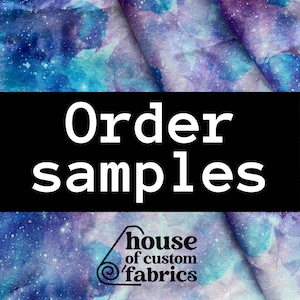 May include: A close-up of a blue and purple fabric with a galaxy print. The fabric is folded in half and the text "Order samples" is written in white on a black background. The text "house of custom fabrics" is written in white on a black background with a swirl design.