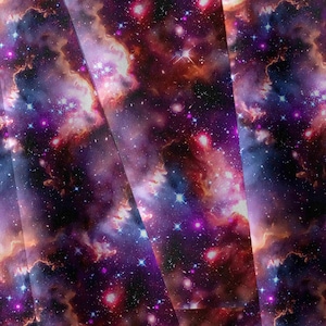 May include: A fabric print featuring a deep space galaxy theme with vibrant swirls of purple, magenta, and orange nebulae. The design is scattered with numerous bright white and blue stars of varying sizes against a dark black background.
