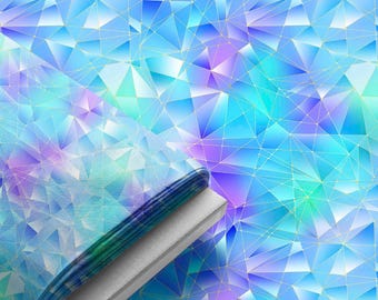 May include: A folded stack of fabric featuring a geometric pattern of triangles in shades of blue, cyan, and purple. The design includes thin, intersecting gold lines that form a network across the surface, creating a faceted, crystalline appearance.