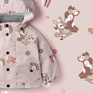 May include: A light pink hooded jacket featuring a repeating pattern of brown deer, white flowers, and muted rainbow arches. The jacket includes a front placket with black snap buttons, long sleeves with elastic cuffs, and two front pockets.