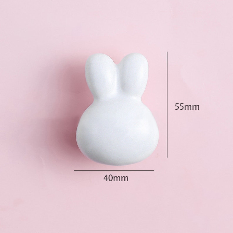 May include: White ceramic bunny-shaped door knob with a 40mm width and 55mm height.