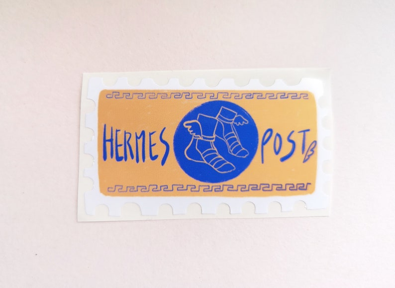 May include: A sticker with a blue circle and a white outline. Inside the circle is a drawing of a winged foot. The text "HERMES POST" is written in blue on a yellow background.