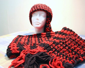 May include: A black and red crocheted hat and scarf set. The hat is a slouchy beanie style and the scarf is long and wide.