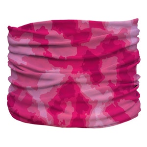 May include: Pink camouflage patterned neck gaiter. The gaiter is made of a soft, stretchy fabric and can be worn as a face mask, neck scarf, or headband.