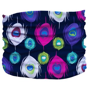 May include: A navy blue fabric headband with a repeating pattern of colorful peacock feathers. The feathers are white, pink, green, and purple with blue eyes.