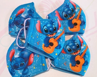 May include: Five blue face masks with a cartoon image of Stitch from Lilo & Stitch playing a guitar. The masks have a blue background with white stars and musical notes.