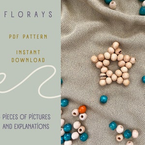May include: A PDF pattern for a wooden bead star, with 45 pictures and explanations. The star is made of natural wood beads and is surrounded by blue and orange beads on a beige fabric background. The text "FLORAYS PDF PATTERN INSTANT DOWNLOAD 45 PIECES OF PICTURES AND EXPLANATIONS" is visible on the left side of the image.
