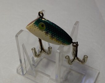 cabo killer fishing lure Cabo Killer by Jansen; Long-casting lures in 2 1/4 and 3 oz. They come in  red and white it's, pink and white, and yellow and orange