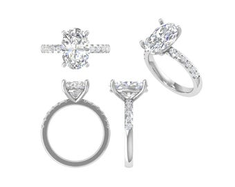 May include: Four views of a silver engagement ring. The ring features an oval-cut central diamond and a band set with smaller accent diamonds. The images show the ring from various angles, including a top-down, side, and profile view.