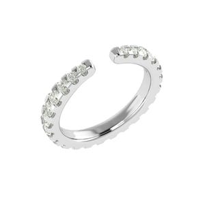 May include: A silver ear cuff featuring a line of small, clear gemstones along the outer edge. The cuff has an open design, wrapping around the ear. The jewellery is set against a white background.