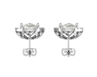 May include: A pair of silver stud earrings. Each earring features a round, clear gemstone surrounded by smaller stones. The earrings have a decorative, openwork design around the main stone and a post with a butterfly backing.