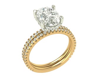 May include: A gold ring featuring a large, oval-cut diamond. The band is gold and set with two rows of smaller diamonds. The ring is displayed against a white backdrop, emphasizing its brilliance and design.