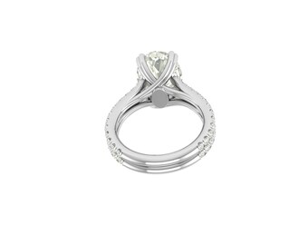 May include: A silver engagement ring with a large, round, light-coloured gemstone. The band features a split shank design with small accent stones. The ring is set against a white background.