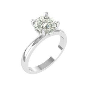 May include: A solitaire engagement ring with a large, round, clear diamond set in a four-prong setting. The band is a polished, shiny silver color. The ring is a classic design, perfect for a proposal.