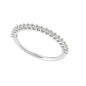 May include: A delicate, silver-colored ring featuring a row of small, sparkling diamonds. The diamonds are evenly spaced along the top of the ring, creating a continuous, shimmering band. The ring's band is smooth and polished.