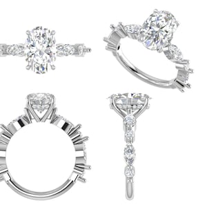 Puede incluir: Vista detallada de un anillo de plata con una piedra central de talla ovalada y piedras de acento más pequeñas. El anillo se muestra desde múltiples ángulos, destacando el intrincado diseño y el brillo de las piedras preciosas. La banda del anillo también es plateada.