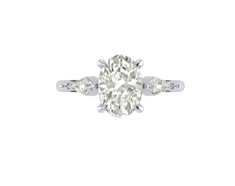 May include: A silver engagement ring featuring an oval-cut central diamond and two pear-shaped side stones. The ring is displayed on a white background, highlighting the brilliance of the gemstones.