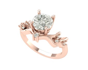 May include: Rose gold engagement ring featuring a large, round, clear gemstone. The ring has a unique design with branch-like accents and smaller accent stones. The ring is set against a white background.