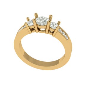 May include: A gold ring with three central round diamonds and smaller diamonds set into the band. The ring has a classic design with a polished finish, highlighting the sparkle of the gemstones. A timeless piece of jewellery.