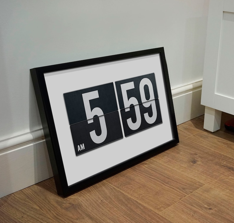May include: A framed print of a vintage-style clock displaying 5:59 AM. The clock has black numbers on a white background.