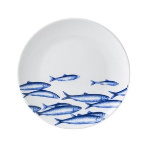 Delft blue plate with fish swimming away, porcelain wall decoration