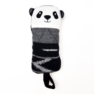 May include: Black and white panda-shaped stuffed toy with a quilted black and white striped body and a black loop handle.