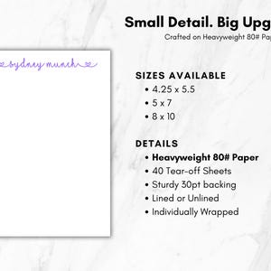 May include: A white notepad with the purple text sydney munch at the top. Text includes Small Detail. Big Upgrade. Crafted on Heavyweight 80lb paper. Sizes available are 10.8 x 14 cm, 12.7 x 17.8 cm, and 20.3 x 25.4 cm. Features 40 tear-off sheets and 30pt backing.