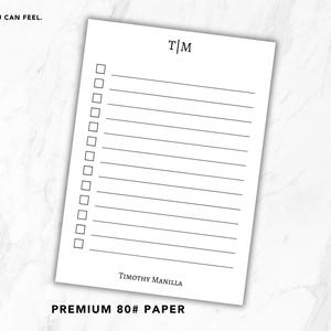 May include: A white notepad sheet featuring a black monogram T|M at the top, a vertical column of twelve empty checkboxes with corresponding horizontal lines, and the name TIMOTHY MANILLA printed in black at the bottom on premium 80# paper.
