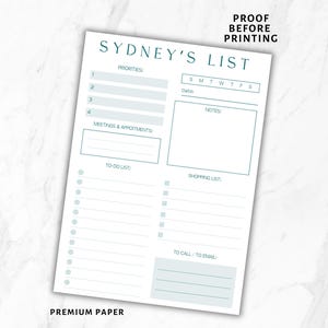 May include: A white notepad with the text "SYDNEY'S LIST" in teal. The notepad includes sections for priorities, meetings, to-do lists, and a shopping list. The words "PROOF BEFORE PRINTING" are at the top.