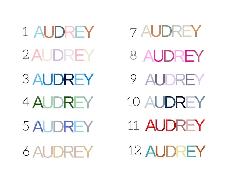 May include: Twelve variations of the name "Audrey" are displayed in different colors and styles. Each instance of the name is numbered from 1 to 12, with a white background.