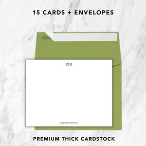 May include: A set of 15 white stationery cards and olive green envelopes. The cards feature the monogram C|M at the top center and the name CHRIS MCGAMIGAN printed at the bottom center in a dark serif font. Text reads 15 CARDS + ENVELOPES.