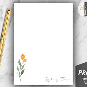 May include: White stationery with a watercolor floral design in orange and green. The name "Sydney Tina" is written in cursive. A gold pen rests on the marble surface. The word "PROOF" is visible.