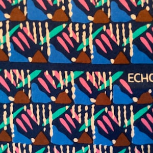 May include: A navy blue textile featuring a repeating pattern of abstract shapes in pink, blue, brown, and green. Vertical white lines and the word "ECHO" are also visible.