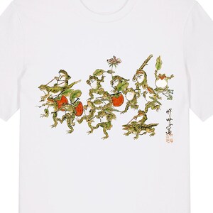May include: White t-shirt with a vibrant illustration of stylized figures, red fruit, and green foliage. The design includes Japanese text and a small insect. The text "Etsy: OldfangledArtShop" and "White" are printed at the bottom.