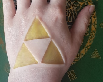 zelda triforce silicone prosthetic | latex free | cosplay | unpainted | encapsulated | sfx  | costume | special effects makeup | gaming