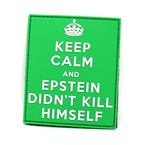 May include: Green patch with white text that reads "Keep Calm and Epstein Didn't Kill Himself". A crown is above the text.