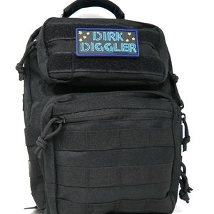 May include: Black tactical backpack with a velcro patch that says "DIRK DIGGLER" in blue and yellow lettering.