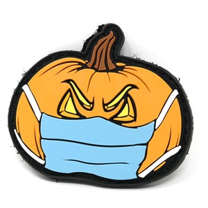 May include: A black and orange Halloween pumpkin with a blue face mask. The pumpkin has a menacing expression with yellow eyes and a frown.