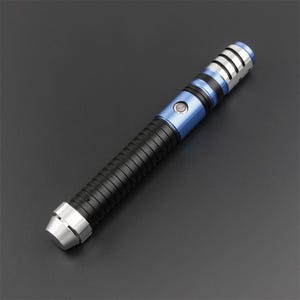 May include: A futuristic lightsaber with a black, ribbed handle and a blue midsection. The hilt features silver accents and a silver tip. The top has a silver and blue design with vertical slits. The overall design is sleek and modern.