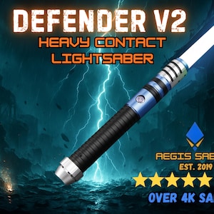 May include: Defender V2 heavy contact lightsaber with a bright white and blue blade. The hilt is black and blue with silver accents. The image includes the text "AEGIS SABERS EST. 2019 SHOP OVER 4K SALES".